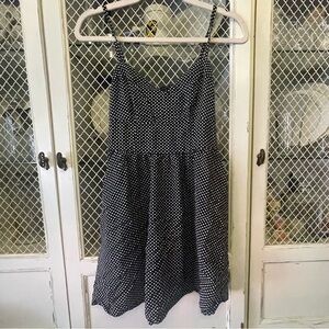 Black mini dress with white spots.